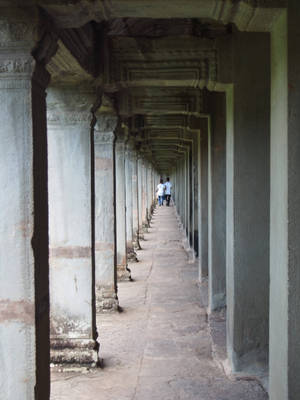 Majestic Angkor Wat Corridor, A Glimpse Of Ancient Cambodia Wallpaper