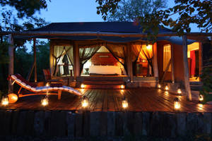 Majestic Azura Selous Lodge Under Starlit Tanzanian Sky Wallpaper