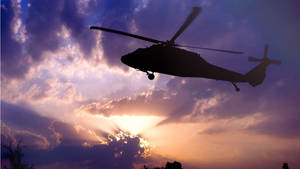 Majestic Flight Of The Black Hawk Helicopter Wallpaper