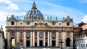 Majestic Front View Of The Basilica At Vatican City Wallpaper