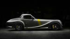 Majestic Morgan Sports Car On A Scenic Road Wallpaper