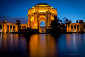 Majestic Palace Of Fine Arts In Vibrant Sunset-colored Background Wallpaper