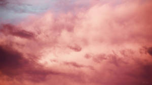 Majestic Pink Cloud Illuminating The Sky Wallpaper