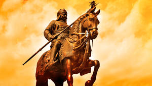 Majestic Rajputana Warrior On Horseback Wallpaper