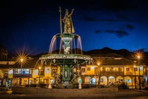 Majestic Statue Of Pachacuti In Cusco, Peru Wallpaper