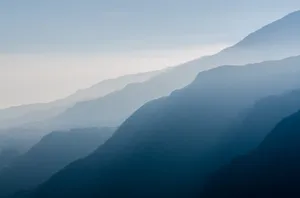 Majestic Sunrise Over Snow-capped Peaks Wallpaper