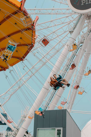 Majestic View Of The Ferris Wheel At Navy Pier, Chicago Wallpaper