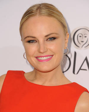 Malin Akerman In Striking Orange Dress Wallpaper