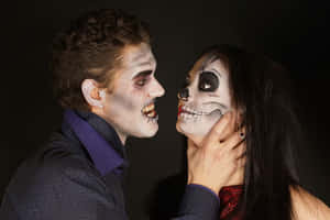 Man Choking A Woman With Face Paint Wallpaper
