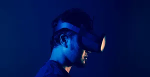 Man Experiencing Virtual Reality Wallpaper