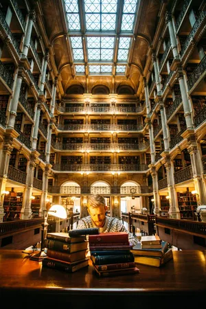 Man In Library Studying Wallpaper