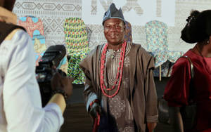 Man In Traditional Nigerian Agbada Robe Wallpaper