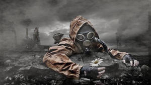 Man On Gas Mask Amid War Wallpaper