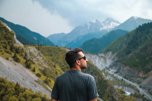 Man On Kazakhstan Mountain Wallpaper