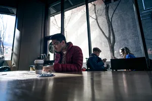 Man On Wide Table Wallpaper