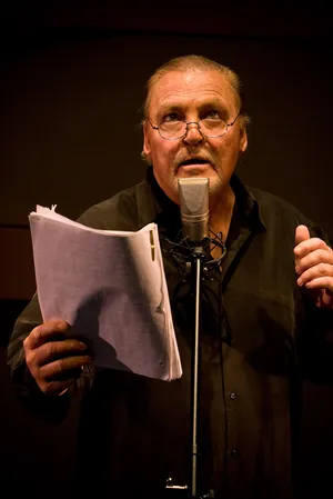 Man Reading Scriptat Microphone Wallpaper