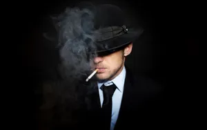 Man Smoking Cigarette Wearing Black Hat Wallpaper