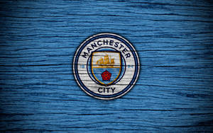 Manchester City 4k Brushed Blue Badge Wallpaper