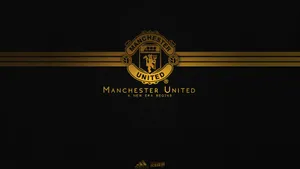 Manchester United Logo In Fancy Gold Wallpaper