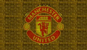 Manchester United Logo In Yellow Brick Wallpaper