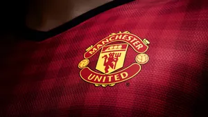 Manchester United Logo On Red Jersey Wallpaper
