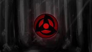 Mangekyou Sharingan Logo In Forest Wallpaper