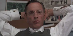 Manin Glasses Leaning Back Wallpaper