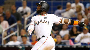 Marcell Ozuna After Hitting A Ball Wallpaper