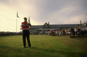 Mark Calcavecchia With His Championship Trophy Wallpaper