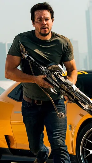 Mark Wahlberg Holding A Weapon Wallpaper