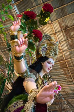 Mata Rani Holding Flowers Wallpaper