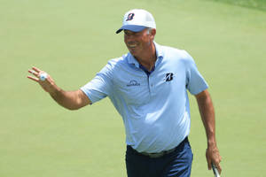 Matt Kuchar Proudly Showing Golf Ball Wallpaper