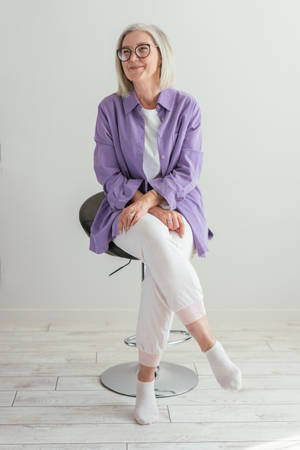 Mature Woman In A Lilac Shirt Wallpaper