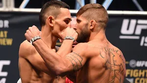 Max Holloway Whispering To Conor Mcgregor Wallpaper