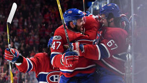 Max Pacioretty Celebrating With Teammates Wallpaper