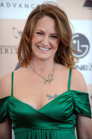 Melissa Leo In A Green Satin Dress Wallpaper