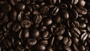 Mesmerizing Aroma Of Dark Roasted Coffee Beans Wallpaper