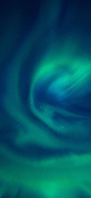 Mesmerizing Aurora Borealis In The Arctic Sky Wallpaper