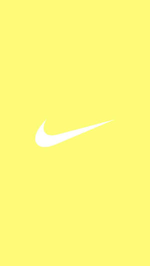 Mesmerizing Splash Of Cute Pastel Yellow Aesthetic With Iconic Nike Logo Wallpaper