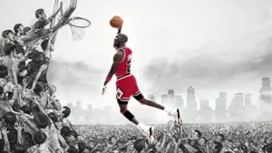 Michael Jordan Drives To The Hoop In His Famous White, Red And Black Air Jordans Wallpaper