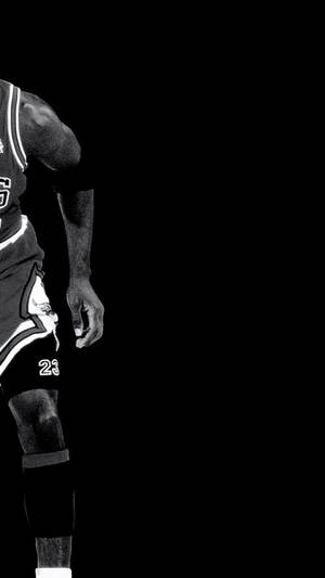 Michael Jordan Elevates During A Game Of Basketball Wallpaper