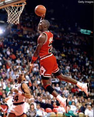 Michael Jordan Soars Through The Air Wallpaper