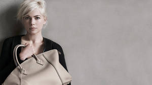 Michelle Williams Holding Louis Vuitton Bag Wallpaper