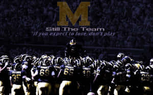 Michigan Wolverines Football Team Charging On The Field Wallpaper