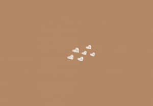 Minimalist Heartson Brown Background Wallpaper