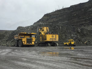 Mining Trucks Muddy Soil Wallpaper