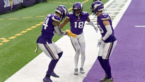 Minnesota Vikings Players Performing Griddy Celebration Wallpaper