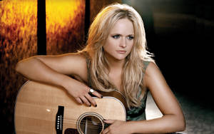 Miranda Lambert With A Brown Guitar Wallpaper