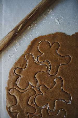 Mix Of Unbaked Christmas Cookies Ready For Baking Wallpaper