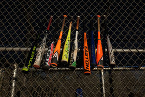 Mlb Bats Hung At Field Fence Wallpaper